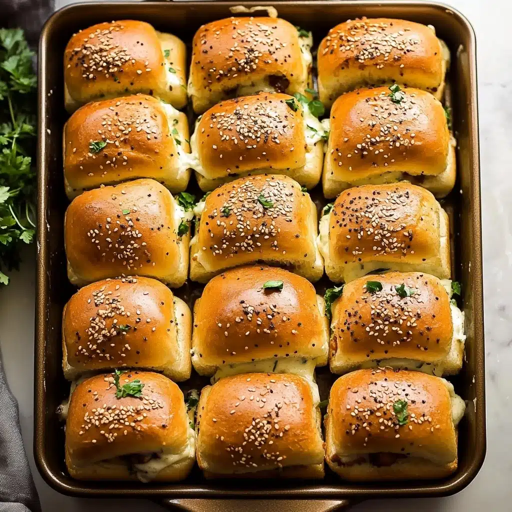 This image shows a baking tray filled with 24 golden brown slider sandwiches placed in a 4 by 6 grid. Each slider has a top bun sprinkled with sesame seeds and small green herbs, with light grill marks visible, giving them a toasted and slightly crispy texture. Underneath the buns, a melted cheese layer peeks out, appearing creamy white and smooth, pressing slightly against the soft buns. The tray sits on a white marbled surface with a few green herb sprigs placed around the edges for decoration. Photo taken with an iphone--v 6.1