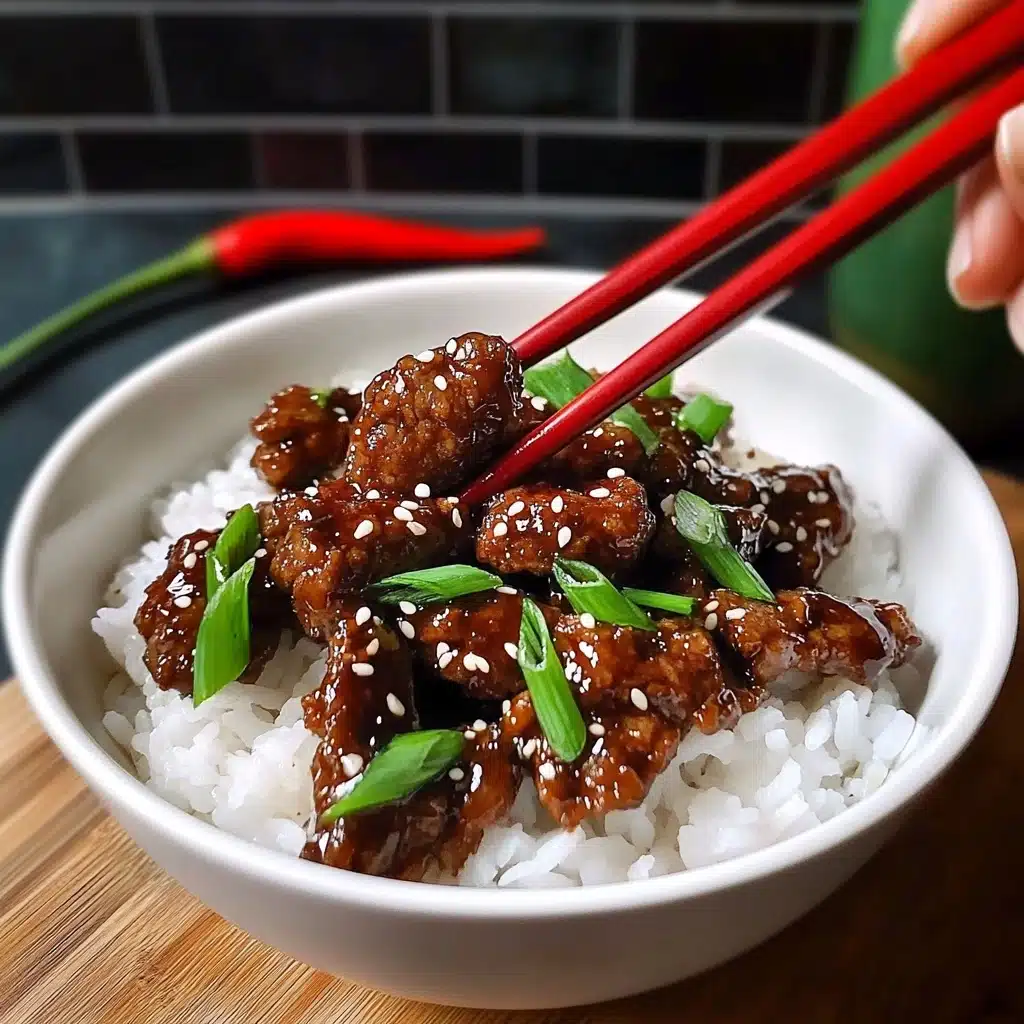 A bowl with two layers: on the bottom is white rice, and on top is dark brown cooked meat pieces covered in sauce. The meat is sprinkled with white sesame seeds and mixed with bright green sliced scallions. The bowl is light blue, set on a wooden board with red chopsticks beside it and a red chili on the right side, all on a white marbled surface. Photo taken with an iphone--v 6.1