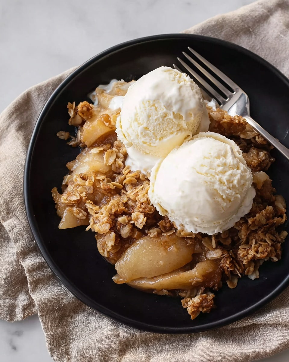 A close-up of a wooden spoon scooping a serving of apple crumble. The dish has two visible layers: the base is made of soft, light yellow cooked apple chunks, and on top is a thick layer of golden-brown crumble textured with oats and small clumps. The apple pieces are partially hidden by the uneven crumbly topping, which looks crisp and slightly coarse. The spoon is placed inside a white plate, set on a white marbled surface. photo taken with an iphone --ar 4:5 --v 7