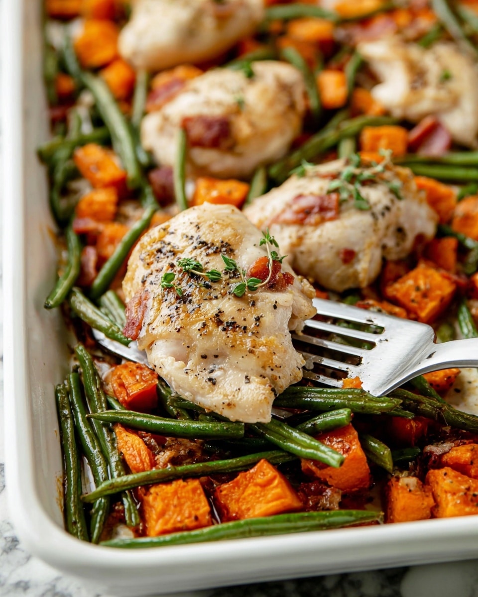 The image shows a close-up of a white baking tray filled with cooked food. The bottom layer is made of small orange cubes of sweet potato, scattered green beans, and pieces of cooked bacon, all mixed together. On top of this layer, there are several pieces of light golden cooked chicken, sprinkled with black pepper and small green herb leaves. A metal spatula is lifting one piece of chicken, with green beans underneath it. The surface beneath the tray is a white marbled texture. photo taken with an iphone --ar 4:5 --v 7