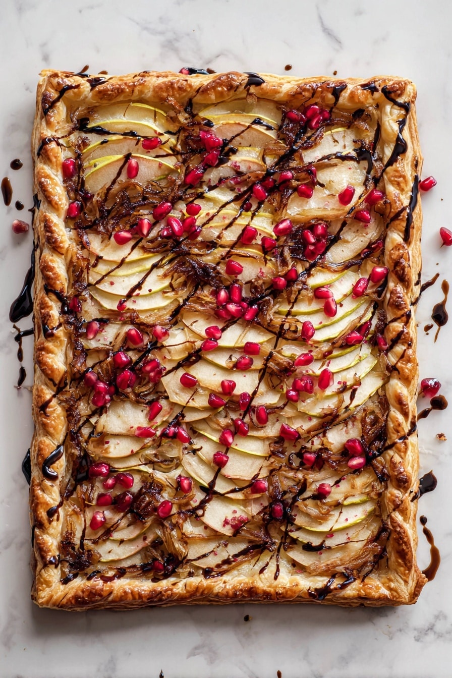 The image shows three rectangular slices of a puff pastry tart placed on white marbled texture. Each slice has a golden brown, flaky crust with a twisted braided border that looks crisp and well baked. The tart surface is layered with thin, slightly browned apple slices arranged overlapping in rows. Between and around the apples, there are dark caramelized parts that add texture, and small bright red pomegranate seeds are scattered on top, giving a pop of color. Some glossy dark syrup is drizzled lightly over the tart, enhancing the visual appeal. The tart rests on white parchment paper with a halved pomegranate partially visible on the left side. photo taken with an iphone --ar 2:3 --v 7 - Apple Brie & Caramelized Onion Tart with Pomegranate, savory apple tart with brie and caramelized onions, elegant pomegranate tart recipe, easy fruit and cheese tart, festive puff pastry tart