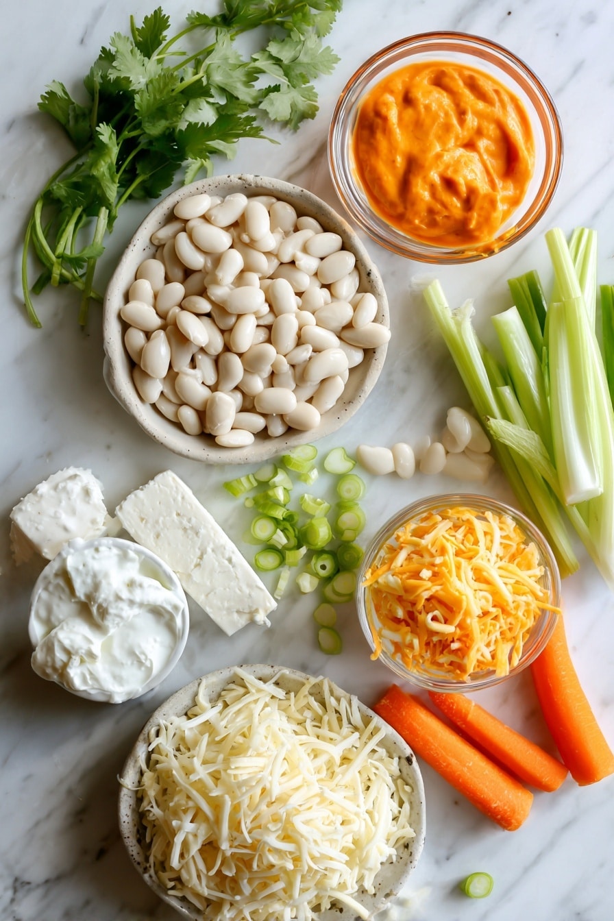 Flat lay of creamy white cannellini beans in a rustic small pile with fresh bright green sliced scallions scattered around, vibrant orange buffalo sauce glistening in a small glass bowl, soft white cream cheese block with smooth texture, a dollop of thick plain Greek yogurt showing its creamy surface, shredded mozzarella and sharp cheddar cheese piles mixing white and deep yellow-orange colors, fresh sprigs of bright green cilantro leaves with delicate texture, crisp orange carrot sticks and pale green celery sticks arranged naturally in bundles, all placed on white marbled surface, photo taken with an iphone --ar 2:3 --v 7 - Vegetarian White Bean Buffalo Dip, white bean buffalo dip, vegetarian party dip, spicy buffalo cheese dip, creamy veggie buffalo dip