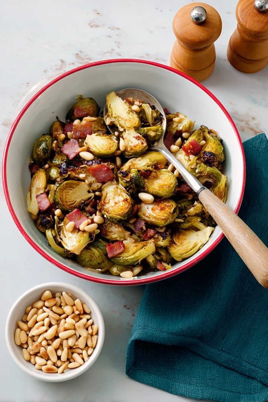 A white bowl with a red rim holds roasted Brussels sprouts, each cut in halves showing a golden brown crispy texture on the outer leaves and tender pale green inner layers. Mixed in are small pieces of cooked bacon with a slightly crispy pinkish-brown look and scattered pale tan pine nuts. There are also a few dark red dried cranberries adding a pop of color among the vegetables. A large silver spoon with a wooden handle rests inside the bowl, partially scooping the Brussels sprouts. The bowl is placed on a white marbled surface with a teal cloth partially visible on the upper left and wooden salt and pepper shakers on the bottom right. Photo taken with an iphone --ar 2:3 --v 7 - Roasted Balsamic Brussels Sprouts with Pancetta, Brussels Sprouts with Pancetta and Balsamic, Balsamic Brussels Sprouts Recipe, Easy Roasted Brussels Sprouts with Pancetta, Fall Brussels Sprouts Side Dish