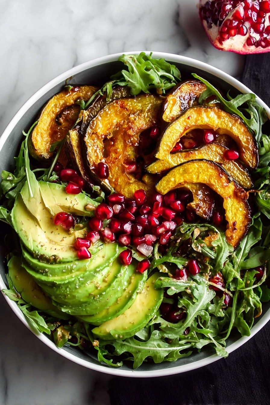 A close-up view of a salad served in a white bowl on a white marbled surface. The salad has a green base layer made of arugula leaves scattered all around. On top of the greens, there are slices of avocado with a light green and creamy texture, along with bright red pomegranate seeds sprinkled evenly. Small pieces of brown pecans add crunch scattered among the salad. The top layer features several slices of roasted orange pumpkin with a slightly shiny and caramelized surface placed casually on one side. A fork is partially dipped into the salad on the left side, and a woman's hand is reaching in from the right corner. In the background, there is a partially visible halved pomegranate. Photo taken with an iphone --ar 2:3 --v 7 - Autumn Arugula Salad with Roasted Acorn Squash, pomegranate, ginger vinaigrette, fall salads, seasonal vegetable salad