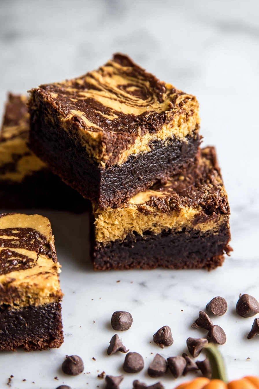 The image shows two stacked dessert bars on a white marbled surface. Each bar has two clear layers: the bottom layer is thick, dark brown, and moist with a dense, crumbly texture resembling a rich chocolate base. The top layer is lighter brown with a golden, slightly crumbly texture mixed with small dark spots, giving it a look of a cookie dough or a crumb topping. Small grated chocolate pieces are scattered on and around the bars, adding finishing detail. The bars have clean edges and a homemade, inviting look. Photo taken with an iphone --ar 2:3 --v 7 - Pumpkin Fudge Brownies, pumpkin fudge brownies recipe, fall brownies with pumpkin, chocolate pumpkin brownies, easy pumpkin dessert