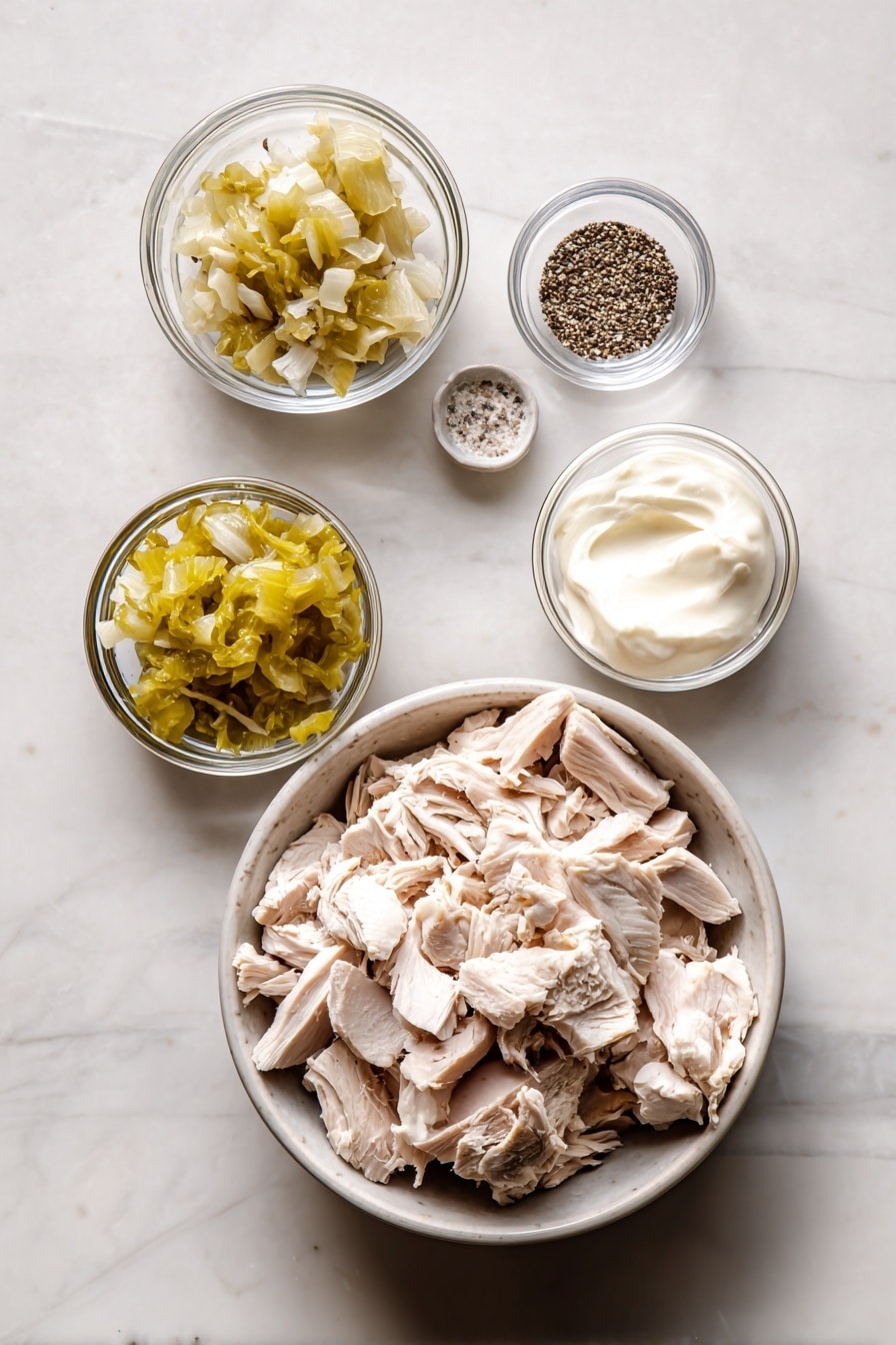 Flat lay of chopped cooked turkey pieces showing both white and dark meat, a small bowl of sweet pickle relish, a dollop of creamy mayo, and small glass bowls with celery salt and black pepper, placed on a white marble surface, photo taken with an iphone --ar 2:3 --v 7 - Turkey Salad, Easy Turkey Salad, Leftover Turkey Ideas, Quick Turkey Salad, Healthy Turkey Salad