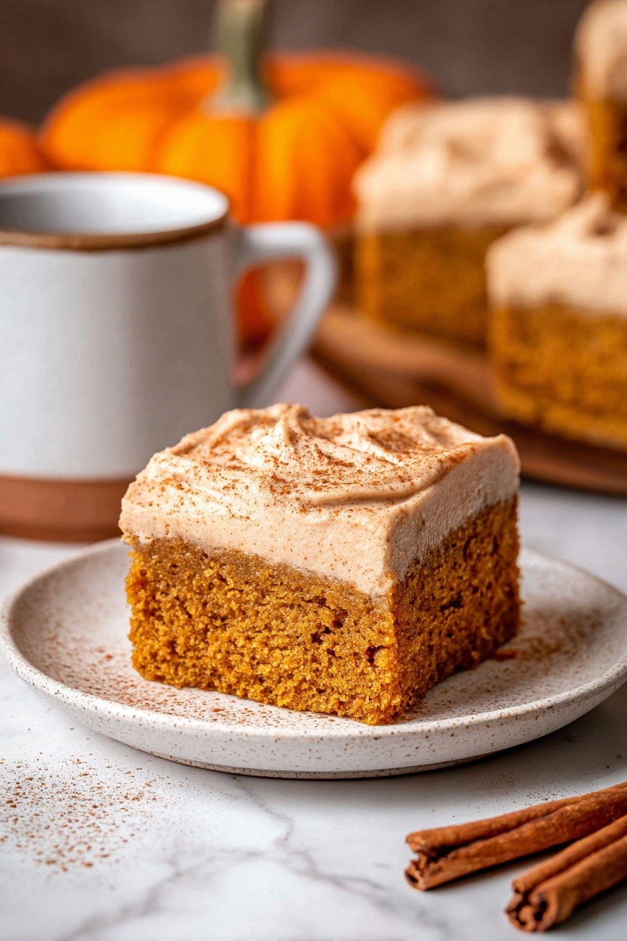 A group of square pumpkin cake pieces with a thick cream-colored frosting, each piece sprinkled lightly with cinnamon on top. The pieces are arranged closely together on white parchment paper on a wooden surface with a white marbled texture, with some pieces slightly moved aside revealing the moist, dense orange cake inside. Two small decorative orange pumpkins, one frosted with white stripes, sit nearby, along with a small plate holding cinnamon sticks and star anise. A ceramic jug with a light brown frothy drink is placed at the bottom right, and a woman's hand holds a piece at the bottom left. Photo taken with an iphone --ar 2:3 --v 7 - Pumpkin Spice Latte Cake with Espresso Cream Cheese Frosting, pumpkin spice cake, fall desserts, pumpkin latte dessert, espresso frosting cake