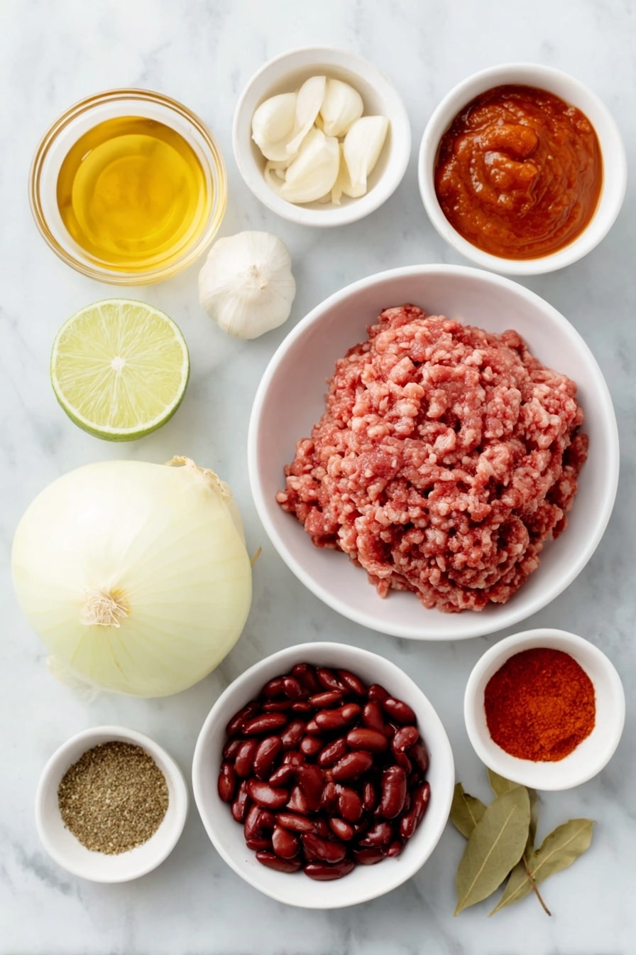 Flat lay of a small white ceramic bowl with golden vegetable oil, a large roughly chopped yellow onion, four peeled garlic cloves, a small white bowl filled with deep red tomato paste, a mound of raw ground beef, a small white bowl of bright red chili powder, a small white bowl with light brown ground cumin, a small white bowl holding smoky paprika powder, a small white bowl with dried oregano leaves, a small white bowl containing dark red cayenne chili powder, a simple white bowl filled with shiny red kidney beans, another white bowl with crushed ripe tomatoes, a small white bowl of amber beer, and a halved fresh lime placed symmetrically and naturally arranged, placed on a clean white marble surface, soft natural light, photo taken with an iPhone, professional food photography style, fresh ingredients, white ceramic bowls, no bottles, no duplicates, no utensils, no packaging --ar 2:3 --v 7 --p awthu7i m7354615311229779997 - Slow-Cooker Beef Chili, easy beef chili, hearty beef chili recipe, slow cooker chili ideas, comforting beef chili
