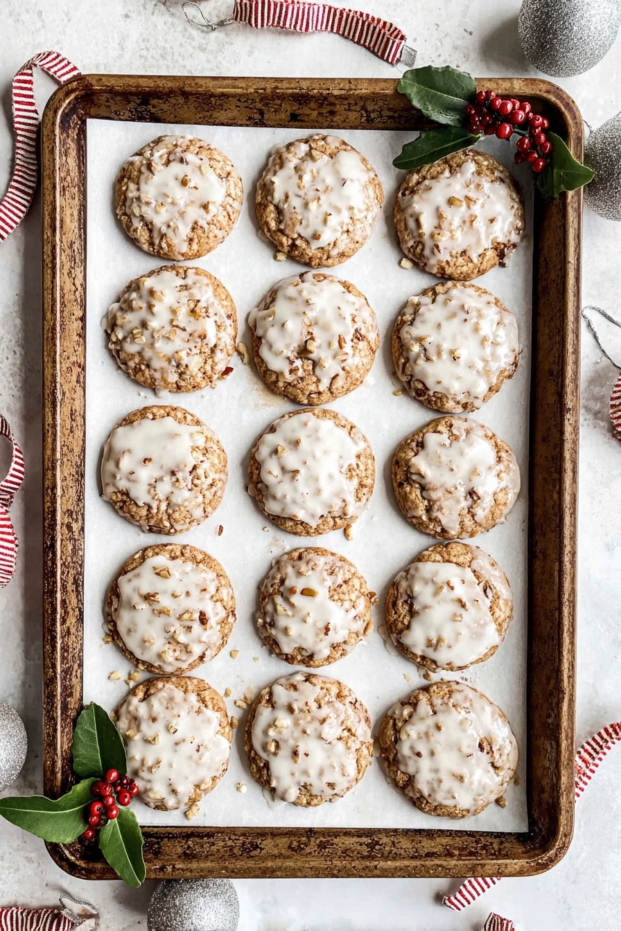 A rustic baking tray filled with twelve round cookies arranged in a 4x3 grid on white parchment paper. Each cookie is golden brown with a slightly rough texture from visible nuts and bits, all topped with a thin, glossy white glaze that covers most of the surface unevenly. Small green leaves and red berries are tucked under the bottom left corner of the tray for decoration. The tray is placed on a white marbled surface with silver jingle bells and red-and-white striped ribbon nearby, creating a festive feel. Photo taken with an iphone --ar 2:3 --v 7 - Gingerbread Oatmeal Cookies, gingerbread cookies, oatmeal cookies, holiday cookies, spiced cookie recipe