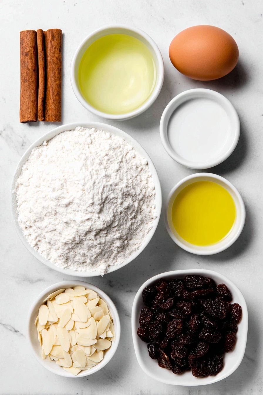 Flat lay of a small mound of all-purpose flour, a few cinnamon sticks broken to reveal ground cinnamon powder beside them, a small white bowl of clear water, a small white bowl filled with golden liquid honey, a small white bowl containing light yellow vegetable oil, one whole uncracked brown egg, a small handful of plump dark raisins, and a small white bowl filled with pale slivered almonds, all arranged in perfect symmetry on a clean white ceramic surface, placed on a clean white marble surface, soft natural light, photo taken with an iPhone, professional food photography style, fresh ingredients, white ceramic bowls, no bottles, no duplicates, no utensils, no packaging --ar 2:3 --v 7 --p m7354615311229779997 - Cinnamon Raisin Challah Bread, Challah bread with cinnamon and raisins, homemade cinnamon raisin challah, braided cinnamon raisin bread, soft challah with raisins