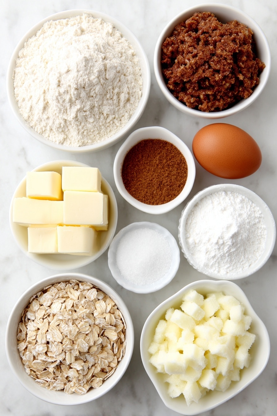 Flat lay of a small mound of all-purpose flour, a small bowl of old-fashioned rolled oats, a small white bowl of ground cinnamon, a small white bowl of ground nutmeg, a small white bowl of salt, a few tablespoons of unsalted butter softened at room temperature, a small pile of brown sugar, a small pile of granulated sugar, one whole uncracked brown egg, a small white bowl of plain full-fat yogurt, two peeled, cored, and finely chopped baking apples, a small white bowl of baking powder, a small white bowl of baking soda placed with perfect symmetry and balanced proportions on a simple white ceramic surface, placed on a clean white marble surface, soft natural light, photo taken with an iPhone, professional food photography style, fresh ingredients, white ceramic bowls, no bottles, no duplicates, no utensils, no packaging --ar 2:3 --v 7 --p m7354615311229779997 - Cinnamon Apple Oatmeal Muffins, healthy breakfast muffins, apple oatmeal muffins, cinnamon muffin recipes, easy apple muffins