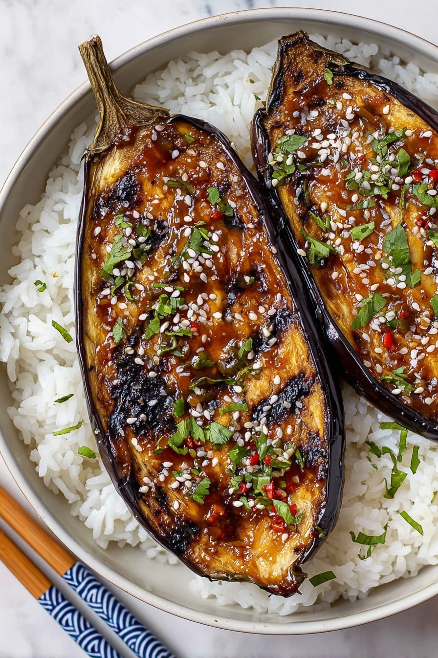 Four halved roasted eggplants with dark, charred skins and golden-brown caramelized tops are placed vertically on white parchment paper over a white marbled surface. Each eggplant half has a slightly wrinkled texture with grill marks and a sticky glaze that adds a shiny orange hue to the browned flesh. The stems remain attached, showing a greenish-yellow color. The overall look is rustic with varied burnt edges and soft, tender centers. Photo taken with an iphone --ar 2:3 --v 7 - Miso Eggplant, Eggplant recipe, Umami vegetable dish, Easy Asian eggplant, Healthy eggplant appetizer