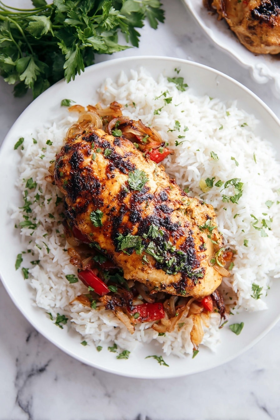 A white plate with a large grilled chicken piece on top, showing a golden brown color with some darker charred spots and sprinkled green herbs. Under the chicken is a layer of cooked onions and red peppers, soft and slightly caramelized. Surrounding the chicken and vegetables is a bed of white rice, fluffy with a few scattered green herbs. A small bunch of fresh parsley rests near the edge of the plate, and the plate is set on a white marbled surface. photo taken with an iphone --ar 2:3 --v 7 - Stuffed Chicken Breast with Cheese and Mushrooms, cheesy stuffed chicken, mushroom stuffed chicken recipe, easy stuffed chicken breast, flavorful chicken main dish
