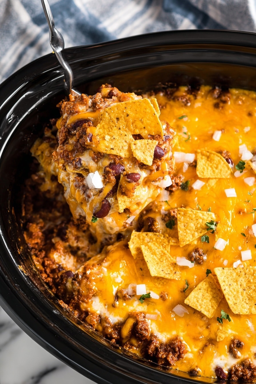 The dish is a close-up view of a layered casserole in a black round slow cooker. The bottom layer is a smooth white cream base, covered by a thick, melted orange cheese layer that spreads evenly across the top. Scattered over the cheese are small chunks of white onion, giving a bit of texture contrast. Additionally, crispy, golden-brown corn chips are sprinkled lightly on the surface, adding crunchy detail. The slow cooker rests on a white marbled surface. photo taken with an iphone --ar 2:3 --v 7 - Chili Cheese Casserole with Fritos, cheesy chili casserole, slow cooker chili casserole, easy comfort food recipes, Fritos chili bake