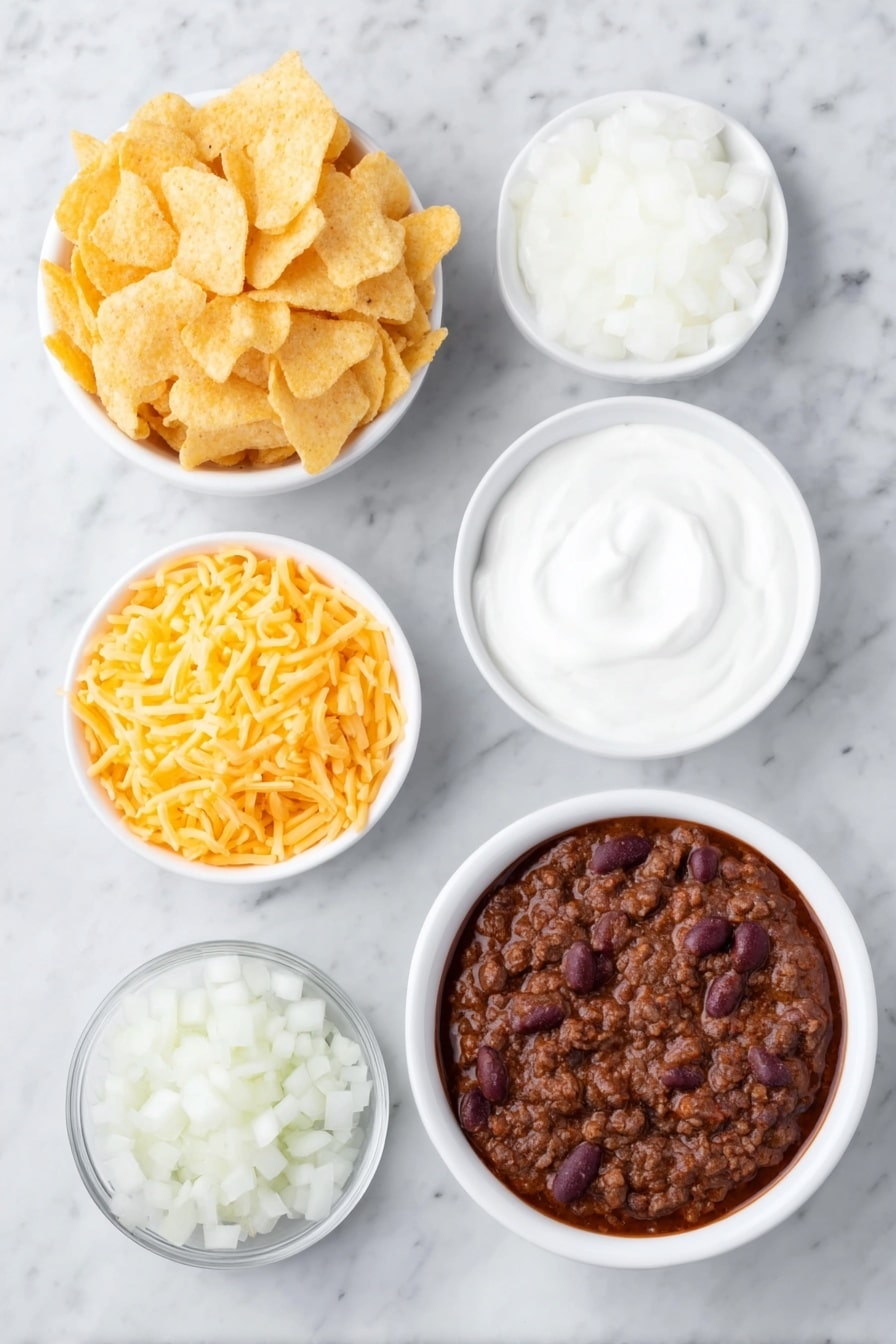 Flat lay of a small mound of golden corn Fritos chips, a small white ceramic bowl filled with thick dark red chili with visible beans and ground beef, a neat pile of shredded sharp cheddar cheese with bright orange and yellow hues, a small white bowl of smooth white sour cream, and a handful of freshly diced white onions scattered nearby, all arranged with perfect symmetry on a clean white marble surface, soft natural light, photo taken with an iPhone, professional food photography style, fresh ingredients, white ceramic bowls, no bottles, no duplicates, no utensils, no packaging --ar 2:3 --v 7 --p m7354615311229779997 - Chili Cheese Casserole with Fritos, cheesy chili casserole, slow cooker chili casserole, easy comfort food recipes, Fritos chili bake