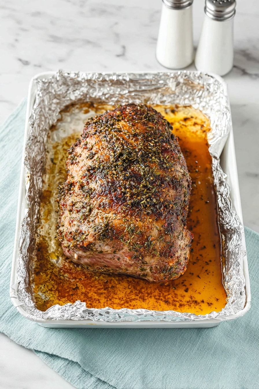 A white round plate is arranged with three main layers: bright green broccoli florets on the left, a smooth bed of creamy white mashed potatoes covering the majority of the plate, and two browned, seasoned pork chops with a slightly crispy texture layered over the mashed potatoes in the lower right. Small sprigs of fresh thyme are scattered on the mashed potatoes, adding a touch of green. The plate rests on a white marbled surface with a pale blue cloth napkin partially visible at the bottom right. Photo taken with an iphone --ar 2:3 --v 7 - Juicy Roast Boneless Lamb Leg, roasted lamb recipes, tender lamb roast, lemon herb lamb, Sunday dinner lamb